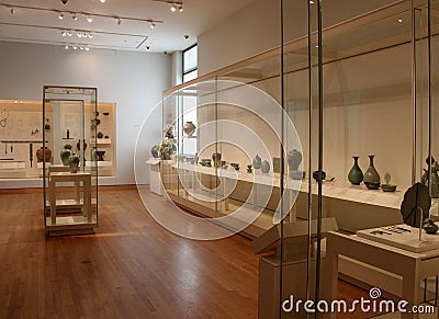 Several glass cases filled with artifacts, Museum of Fine Arts, Boston, Mass, summer, 2021 Editorial Stock Photo