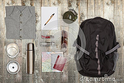 Several hiking items, on top of rustic wooden table. Stock Photo