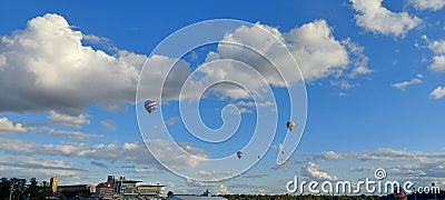 Several Hot air balloons flying over York Racecourse York city Knavesmire North Yorkshire Stock Photo