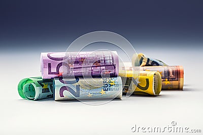 Several hundred euro banknotes stacked by value. Euro money concept. Rolls Euro banknotes. Euro currency. Stock Photo