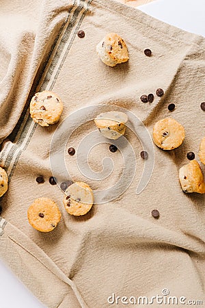 Several little Chocolate chips muffins with some chocolate chips on the background. Tasty and sweet concept Stock Photo