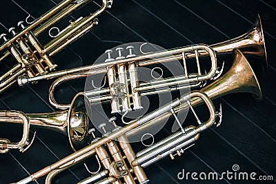 Several musical wind instruments orchestra golden trumpets. Stock Photo