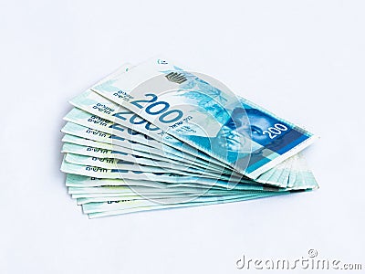 Several new banknotes worth 200 Israeli new shekels on a white background Stock Photo