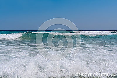 Several ocean foamy wave with blue clean sky Stock Photo