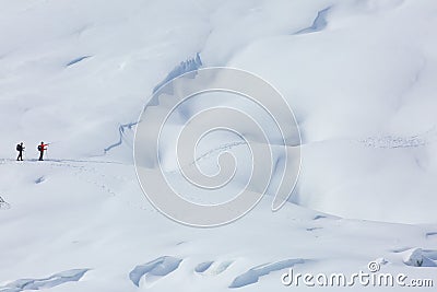 SEVERAL PEOPLE WALK ON MOUNTAIN . Editorial Stock Photo