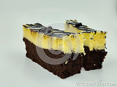 several pieces of brownie cake on a white background Stock Photo