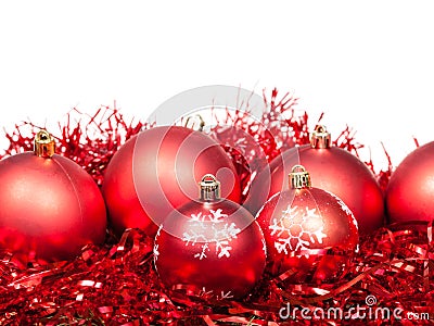 Several red Christmas balls and tinsel isolated Stock Photo