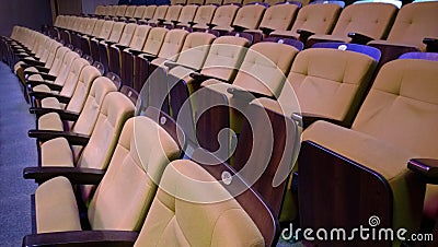 Several rows of folding comfortable padded seats Stock Photo