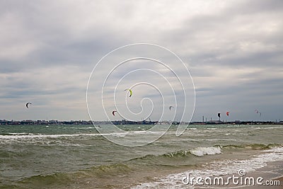 Several sails of kate surfers in the sea against the backdrop of a big city. Odessa. Ukraine. 2020.05.24 Editorial Stock Photo