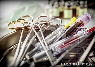 Several scissors of suture and syringes in an operating theater Stock Photo