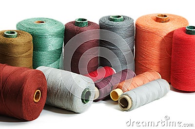 Several sewing spools of various color on white background, isolated Stock Photo