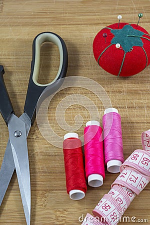 Several sewing tools with red pincushion Stock Photo
