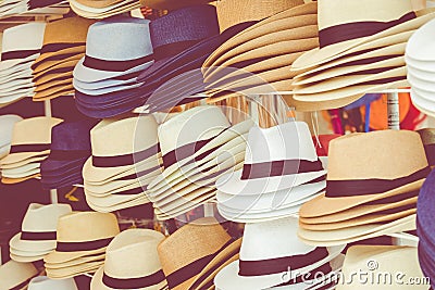 Several straw hats in a flea market Stock Photo