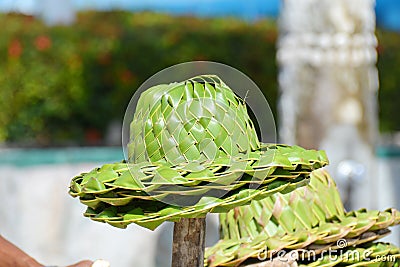 Several straw hats in a heap, on the stick Stock Photo