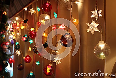 Strings of Holiday Lights shine brightly Stock Photo