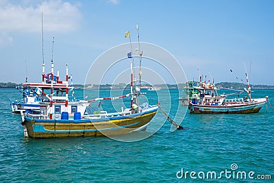 Several traditional local boats to catch fish in Weligama Bay. Stock Photo