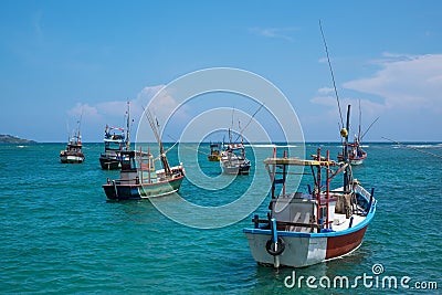 Several traditional local boats to catch fish in Weligama Bay. Stock Photo