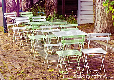 Several wooden table in garden Stock Photo