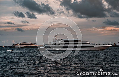 Several yachts in the dusk Stock Photo