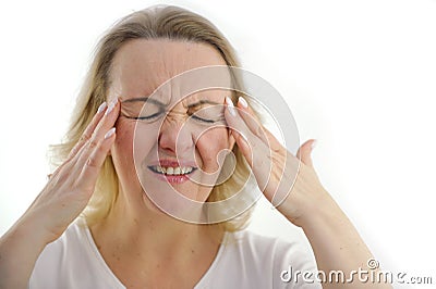 severe headache migraine woman holding hands at temple eyes closed wrinkle forehead mouth ajar in meat disease cold Stock Photo