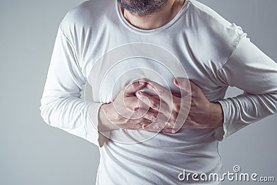 Severe heartache, man suffering from chest pain, having painful Stock Photo