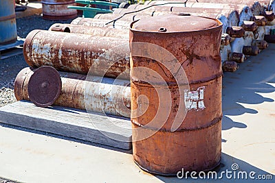 Damaged and rusty steel drum Stock Photo