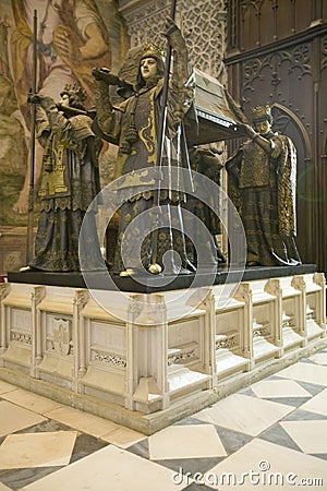 In the Sevilla Cathedral, Southern Spain, is the mausoleum-monument and ornate tomb of Christopher Columbus where four heralds dre Editorial Stock Photo