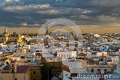 Sevilla historical downtown at cloudy sunset including Cathedral, Plaza de EspaÃ±a and other Stock Photo