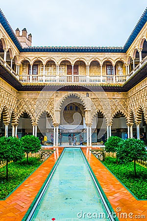 SEVILLA, SPAIN, JANUARY 7, 2016: view of the courtyard of the maidens situated inside of the royal alcazar palace in the Editorial Stock Photo