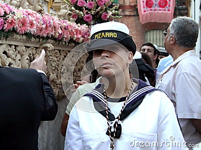 An unknown employee of the Navy at a religious festival in Seville Editorial Stock Photo