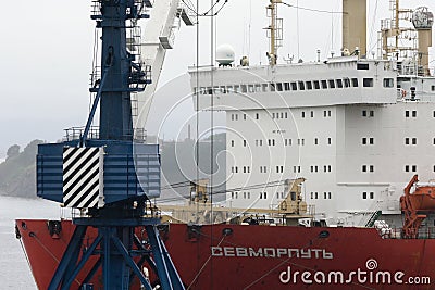 Sevmorput - Russian nuclear-powered icebreaking lighter aboard ship carrier, container ship anchored in container terminal commerc Editorial Stock Photo