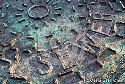 Sewer Cover Closeup Stock Photo