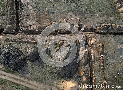 sewer excavations and piles of earth at the construction site Stock Photo