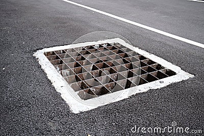 Sewer manhole or Pavement. Stock Photo