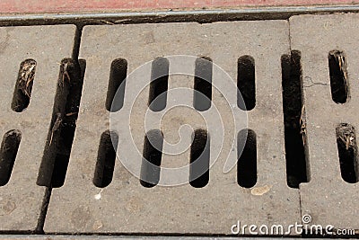 Sewer System Concrete Road Grid Grate Blocks For Drain Rain Water Photo Shot. Stock Photo