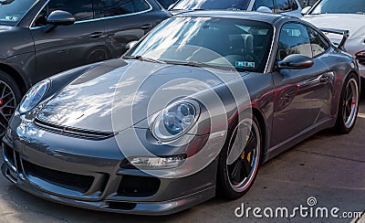 Sewickley, Pennsylvania, USA March 5, 2023 A used, gray Porsche coupe for sale at a dealership Editorial Stock Photo