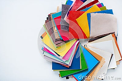 Sewing accessories, multi-colored fabric samples on a white background Stock Photo
