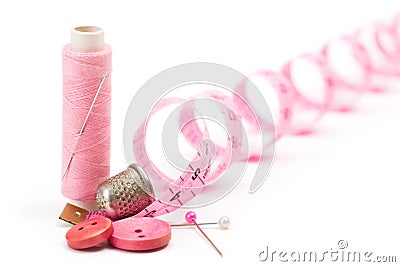 Sewing accessories: thread, needle and thimble Stock Photo