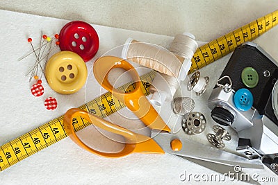 Sewing background with color threads, buttons, meter and scissors Stock Photo