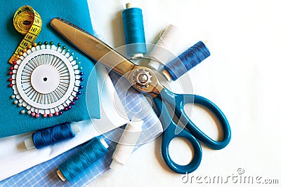 Sewing background with color threads, meter, pins and scissors Stock Photo