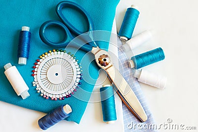 Sewing background with color threads, meter, pins and scissors Stock Photo