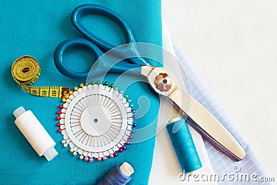 Sewing background with color threads, meter, pins and scissors Stock Photo