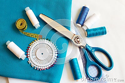 Sewing background with color threads, meter, pins and scissors Stock Photo