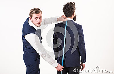 Sewing exclusive clothes concept. Businessman, client, customer visit tailor salon. Stock Photo