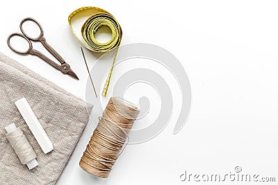 Sewing hobby with tools, thread, scissors white background top view space for text Stock Photo