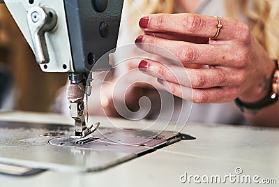 Sewing machine, seamstress woman hands and fashion designer with thread work. Small business, entrepreneur and female Stock Photo