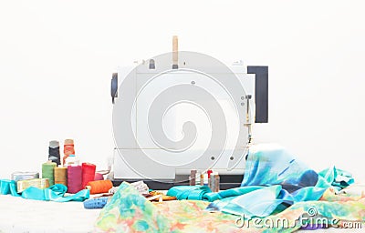 Sewing machine with sewing accessories on table Stock Photo