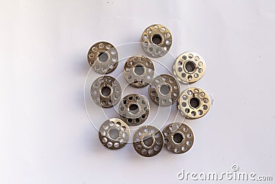 sewing machine steel yarn, bobbin for thread on white background Stock Photo