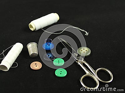 Sewing Needle thread scissors thimble tailor buttons Stock Photo