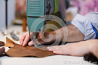 Sewing process on the old seawing mashine. Selective focus. Stock Photo